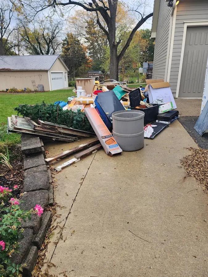 Dumpster being loaded with debris for Estate Cleanout Dumpster Rental in San Luis Obispo